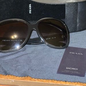 Used PRADA sunglasses. In GREAT shape with case and cloth